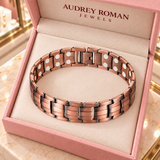 Overhead view of the Clara Chain Bracelet in copper tone in an Audrey Roman Jewels box on the boutique counter.