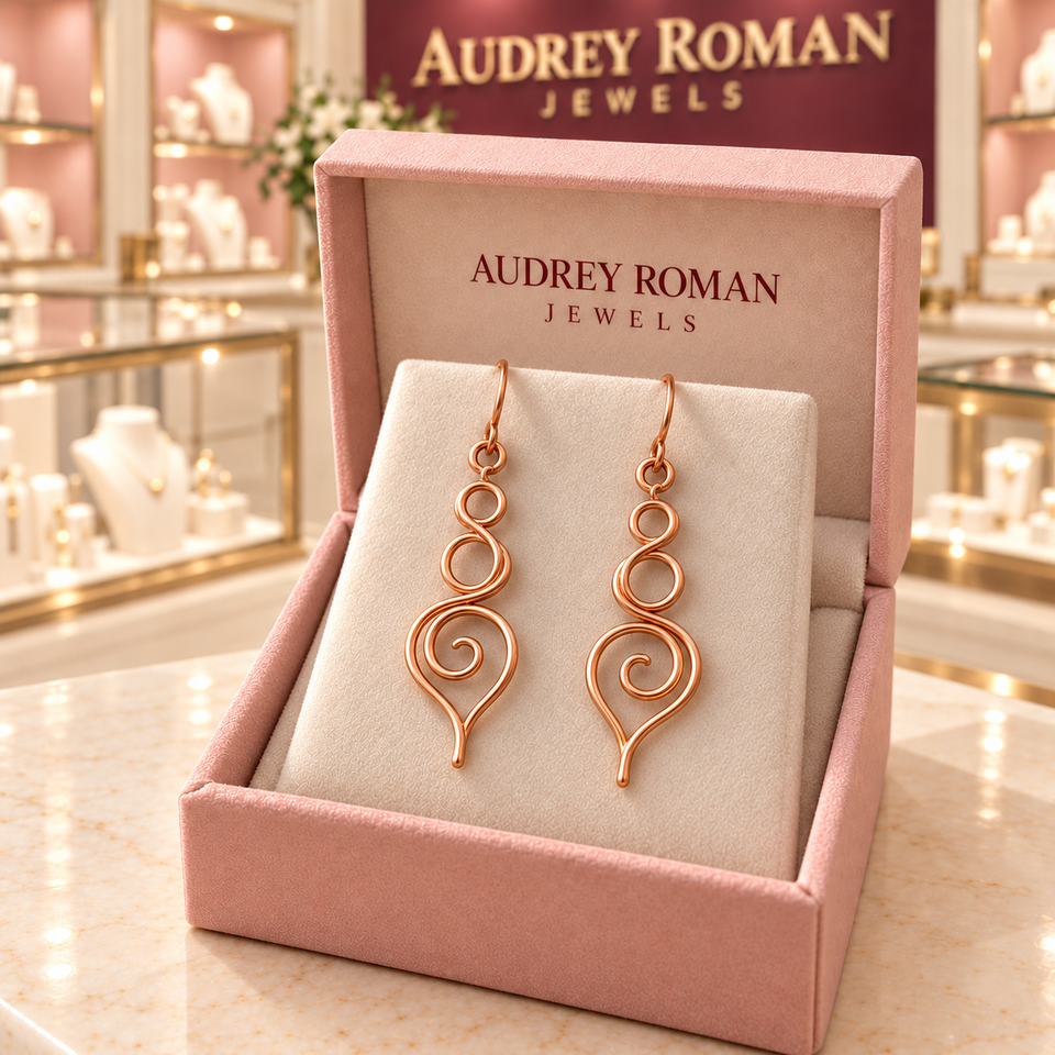 Eleanor Swirl Earrings in its rose Audrey Roman Jewels box inside the boutique.