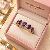 Hazel Purple Crest Ring (rose-gold-tone) viewed from above inside the Audrey boutique.
