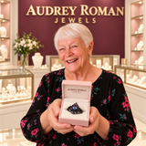 Alice Purple Layered Ring (black finish) presented in its rose box by the woman in the Audrey boutique.