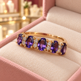 Hazel Purple Crest Ring (rose-gold-tone) in a close detail view inside the Audrey boutique.