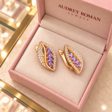 Imogen Earrings (rose-gold-tone) viewed from above inside the Audrey boutique.