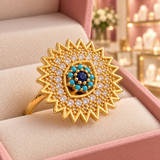 Victoria Blue Sunburst Spinner Ring | Gold-Tone close-up detail in the Audrey boutique.